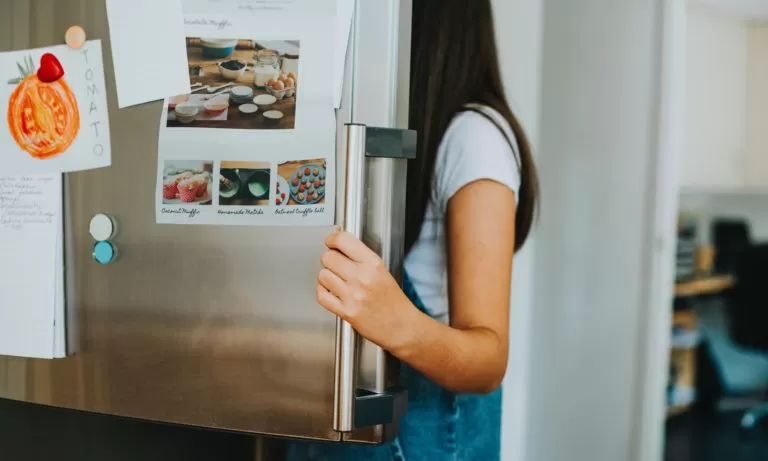 person-looking-into-an-edmonton-fridge-that-has-been-cleaned-under