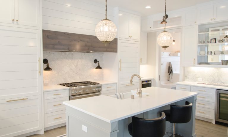 a-white-edmonton-kitchen-with-an-island-that-has-been-recently-renovated