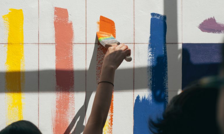 people-testing-paint-colours-on-a-white-wall