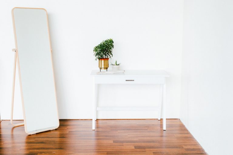 a-white-dresser-and-a-mirror-making-an-edmonton-home-feel-bigger