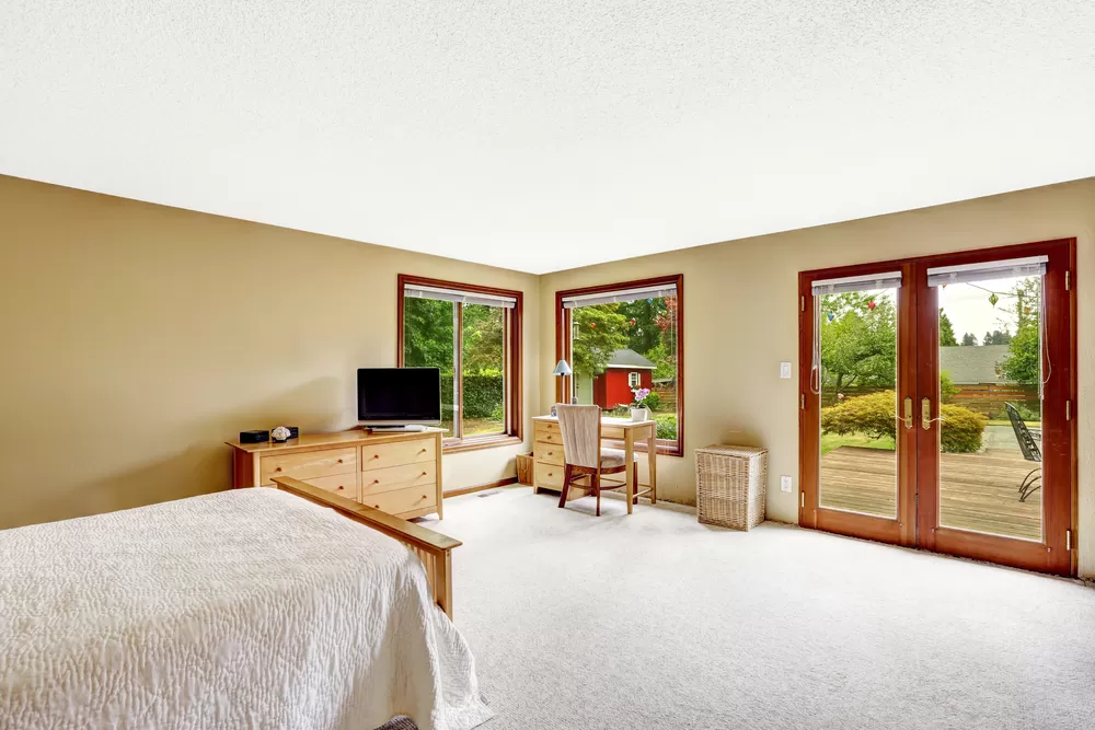 Bedroom with small office area and walkout basement