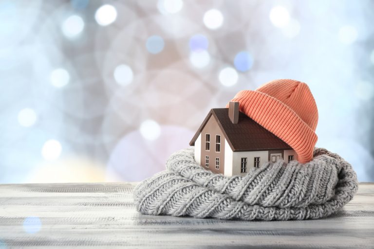 concept image of house wearing a toque and scarf.